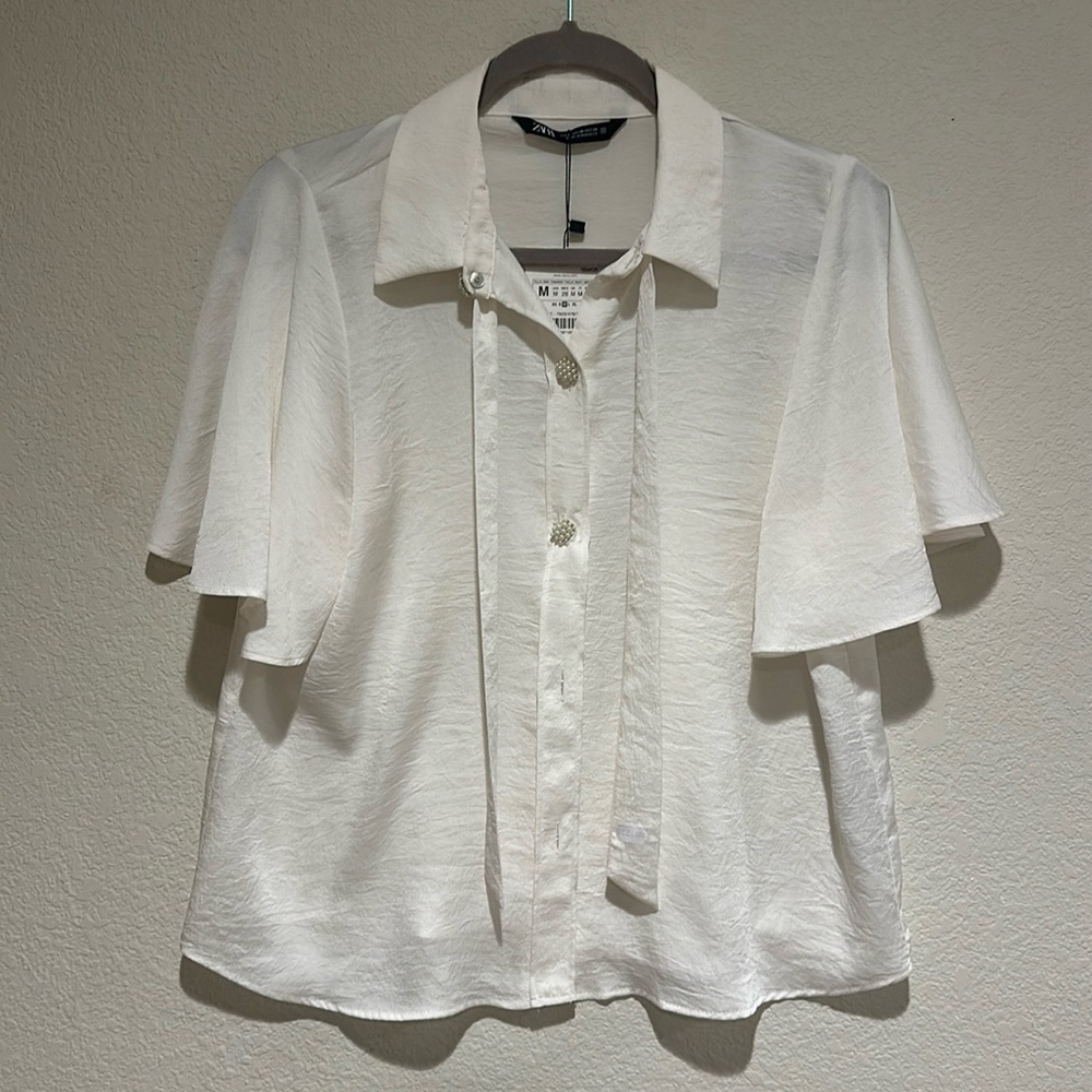 NWT. Zara white dressy blouse with buttons made of tiny pearls (faux).